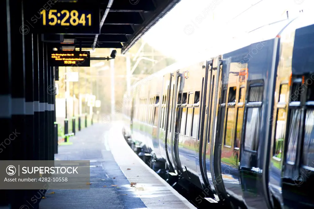 England, West Midlands, Longbridge. A train alongside a platform at Longbridge train station in the West Midlands.
