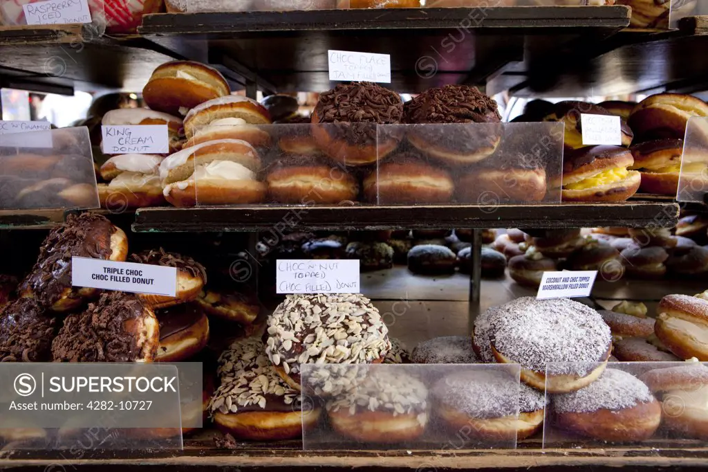 England, London, Camden. A variety of delicious doughnuts for sale in Camden Lock Market.