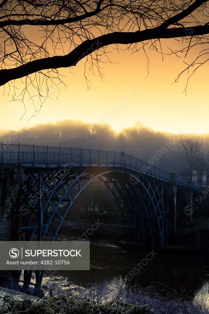 England, Shropshire, Ironbridge. The Iron Bridge, opened on New Year's Day 1781, was the first arch bridge in the world to be made out of cast iron. The bridge was built over the River Severn at the Ironbridge Gorge.