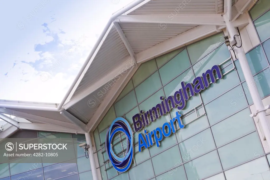 England, West Midlands, Birmingham. Signage on the outside of a terminal building at Birmingham Airport.