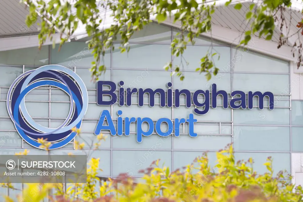 England, West Midlands, Birmingham. Birmingham Airport signage on the outside of the terminal building.