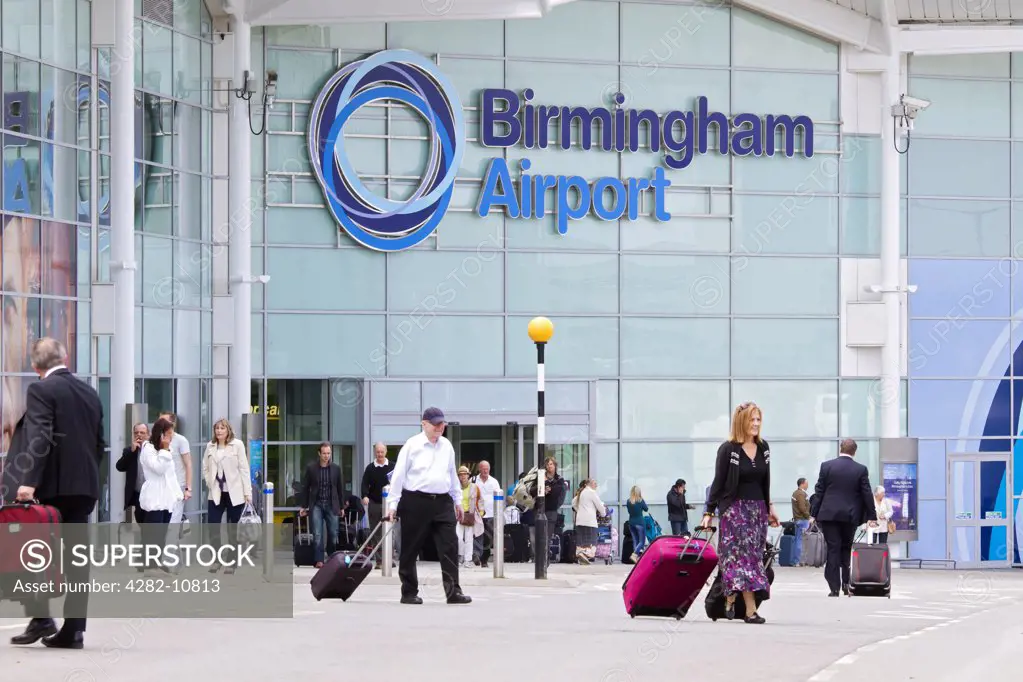England, West Midlands, Birmingham. Passengers outside Birmingham Airport.