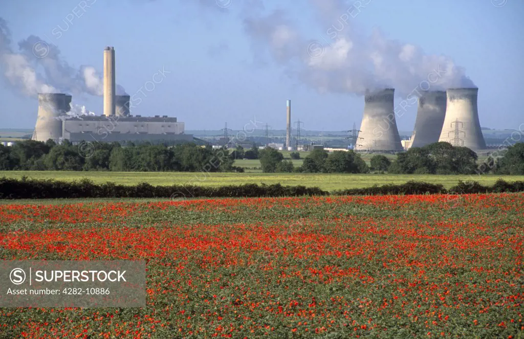 England, Oxfordshire, Didcot. Didcot Power Station and poppy fields.