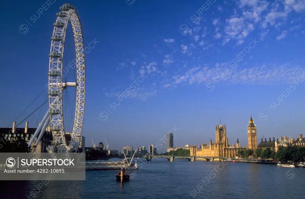 England, London, South Bank. London Eye and Parliament at sunrise.