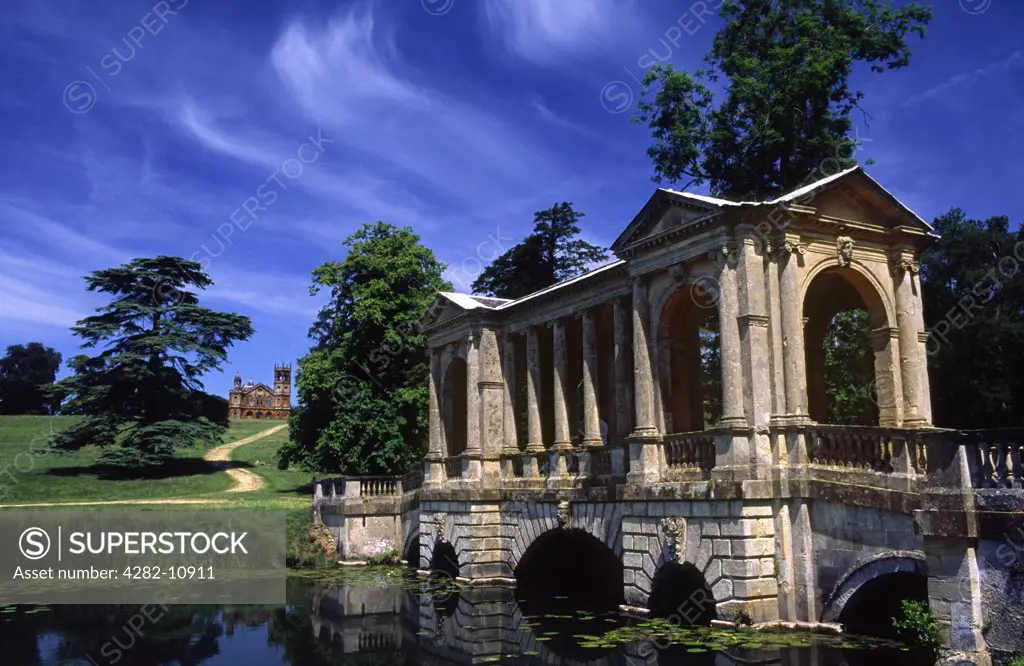England, Buckinghamshire, Buckingham. Palladian Bridge and Gothic Temple at Stowe Gardens.