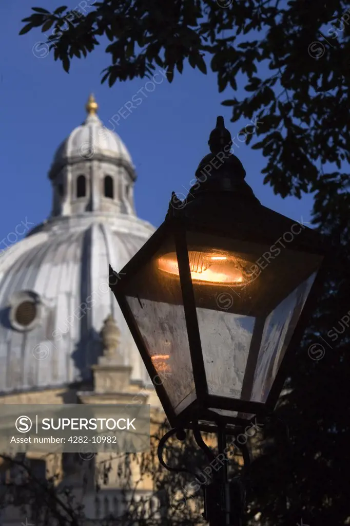 England, Oxfordshire, Oxford. Lighting up time in Radcliffe Square.