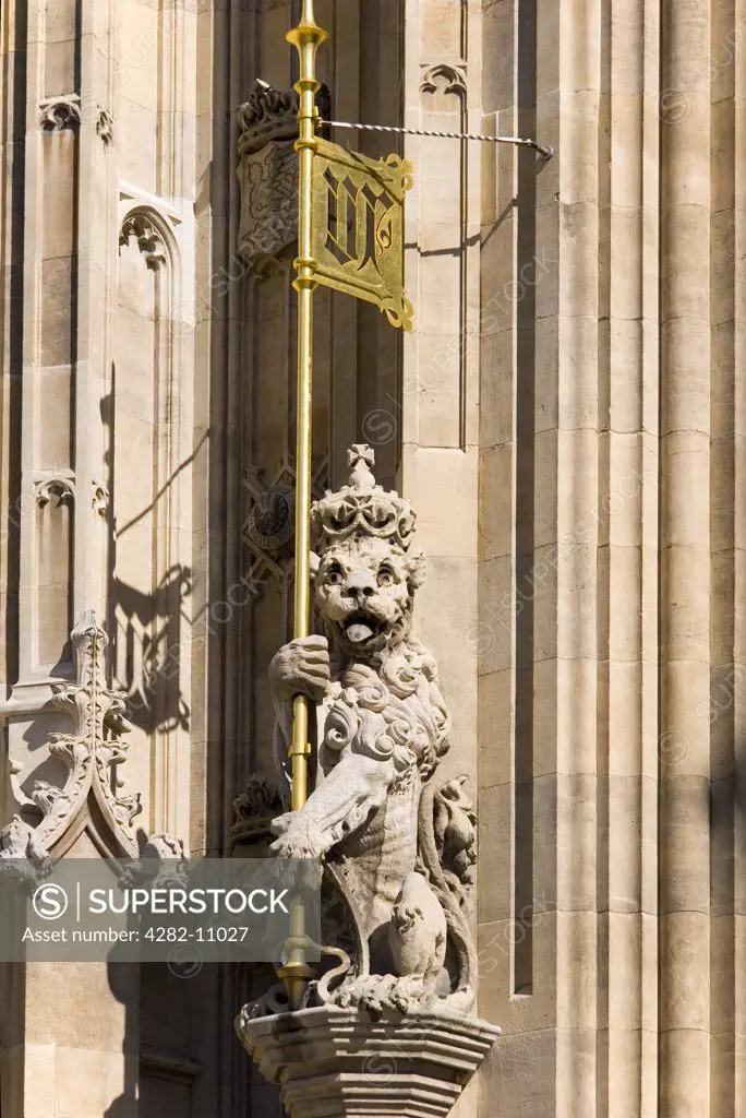 England, London, Westminster. Battered lion with banner at the Palace of Westminster.