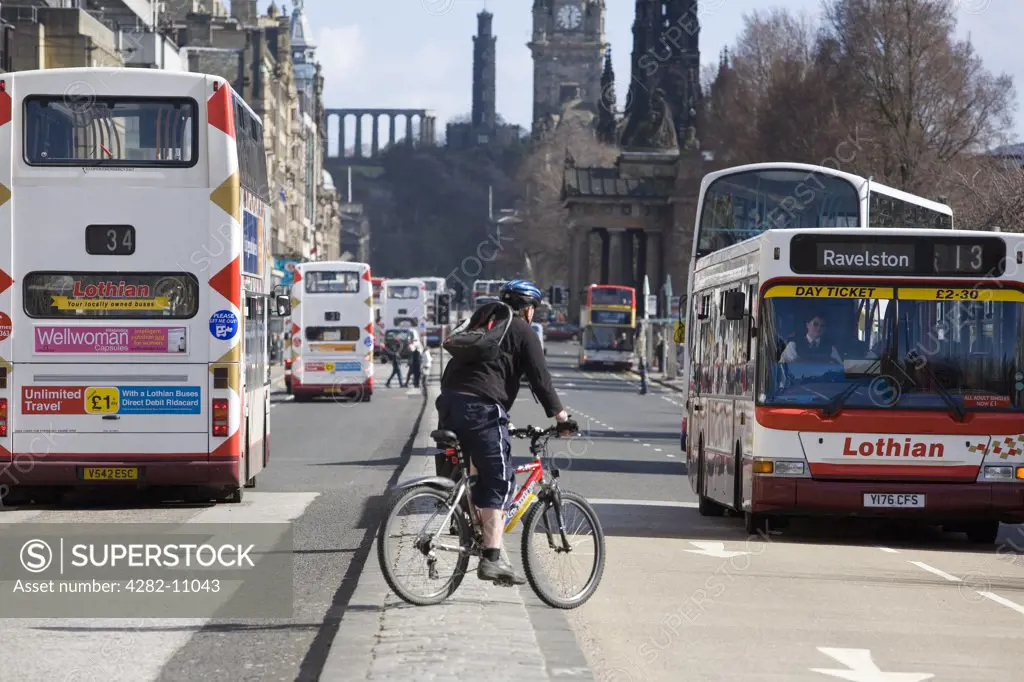 Scotland, Edinburgh, Princes Street. A cyclist on Princes Street.