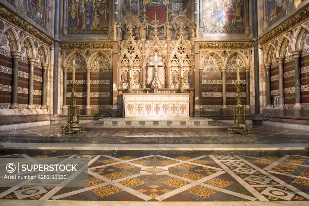 England, Oxfordshire, Oxford. Altar in the Chapel of Keble College. The foundation stone for the chapel was laid on St Mark's Day 1873 and was officially opened on the same day in 1876.