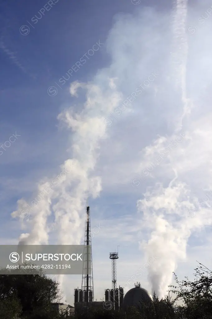 England, Bristol, Avonmouth. A view toward gases being vented from the Avonmouth Refinery.