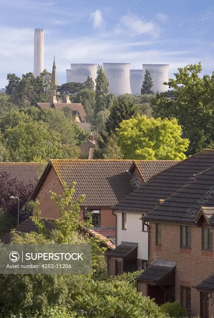 England, Oxfordshire, Didcot. A view toward Didcot Power Station with residential houses in the foreground.