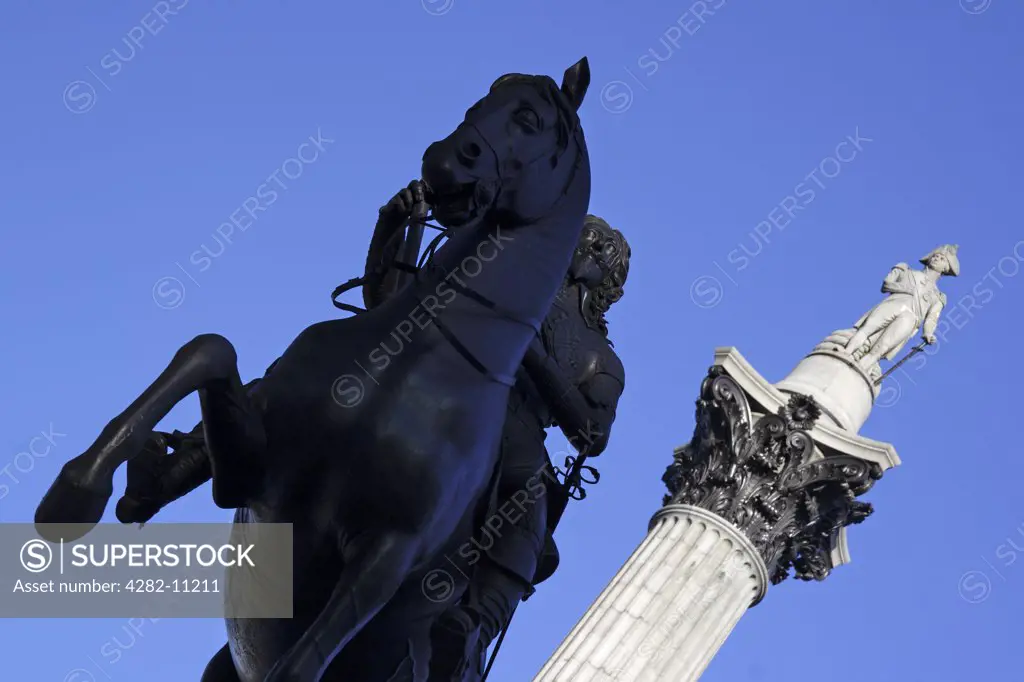 England, London, Trafalgar Square. A statue of Charles 1 in Trafalgar Square with Nelson's Column in the background.