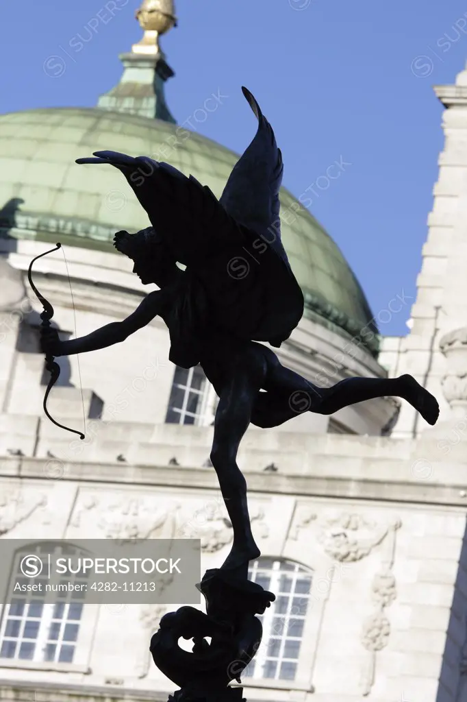 England, London, Piccadilly Circus. The statue of Eros in silhouette.