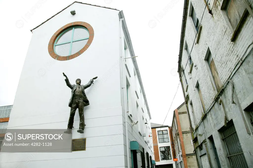 Northern Ireland, Belfast, Belfast. A statue tribute to James Larkin on the side of a building in the streets of Dublin.