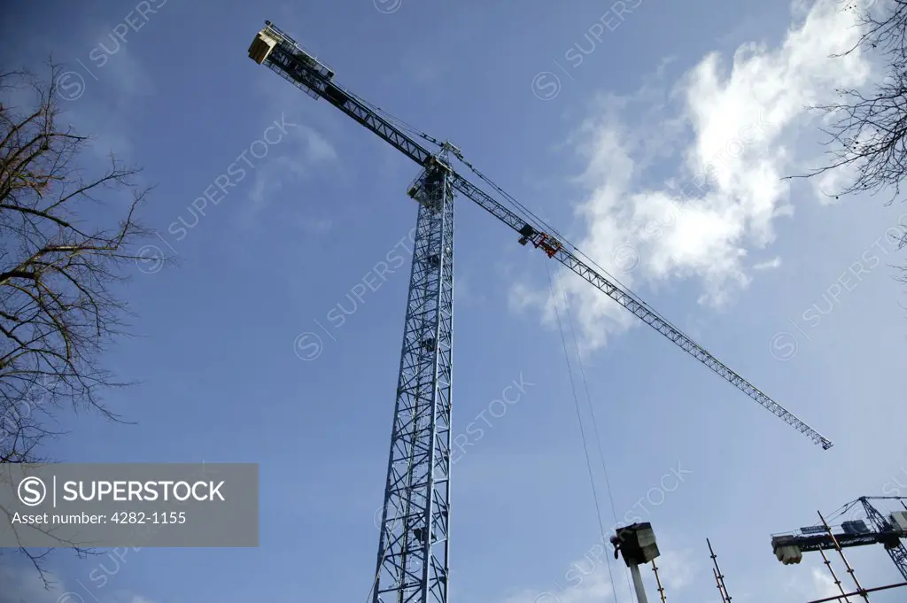 Northern Ireland, Belfast, Belfast. Looking up to blue skies above cranes in Belfast.