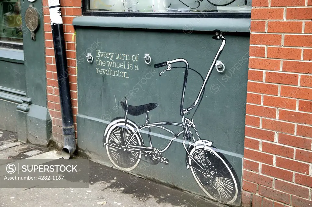 Northern Ireland, Belfast, Belfast. A painting of a low rider bike on a Belfast street wall.
