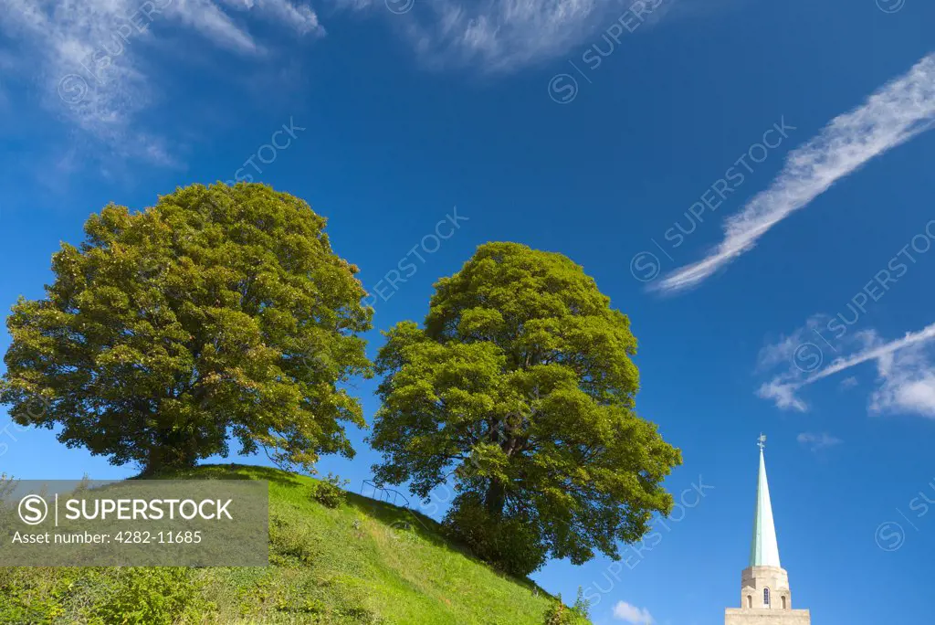England, Oxfordshire, Oxford. The Mound, the site of Oxford castle built in 1071 and the library tower and spire of Nuffield College.