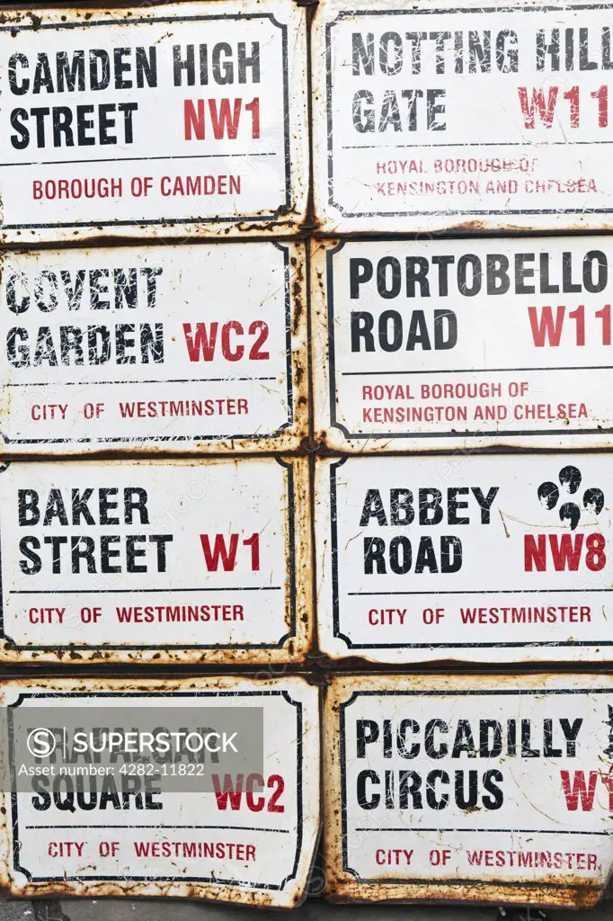 England, London, Notting Hill. Famous London road signs on display outside a shop in Portobello Road.