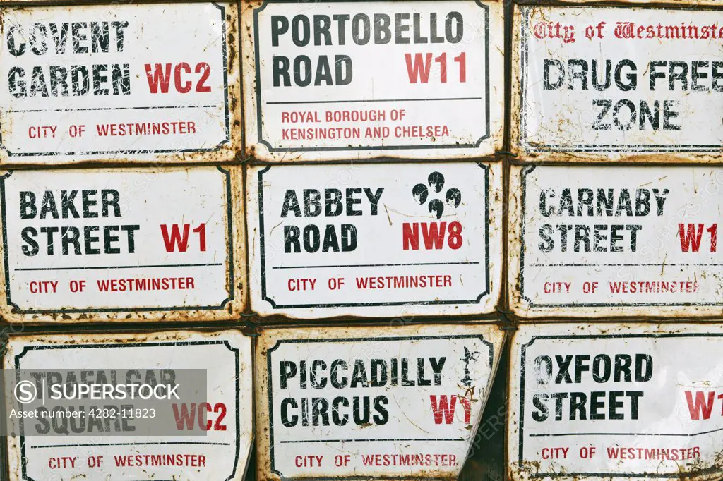 England, London, Notting Hill. Famous London road signs on display outside a shop in Portobello Road.
