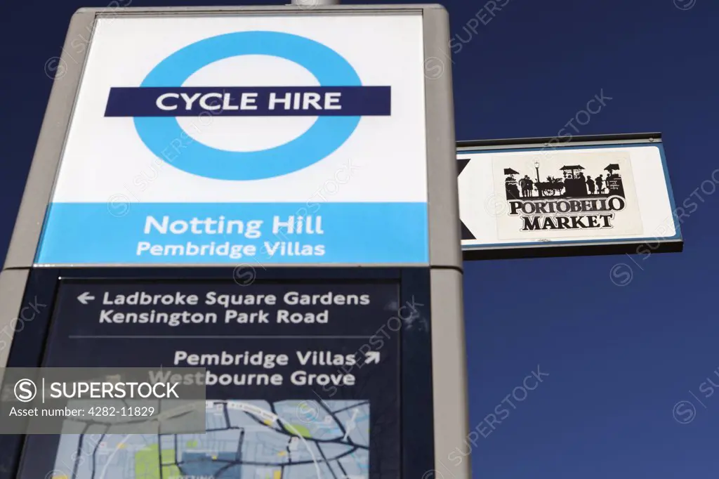 England, London, Notting Hill. Directions to Portobello Market and a Cycle Hire sign.