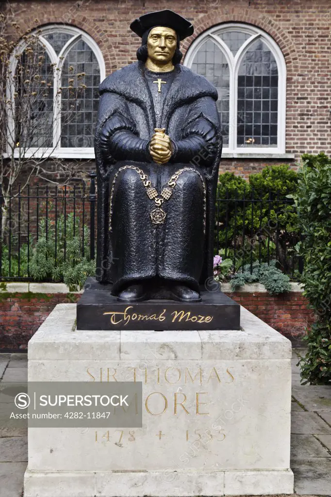 England, London, Chelsea Embankment. Statue of Sir Thomas More 1478 - 1535, an English lawyer, social philosopher, author, statesman and noted Renaissance humanist, outside Chelsea Old Church in Cheyne Walk.