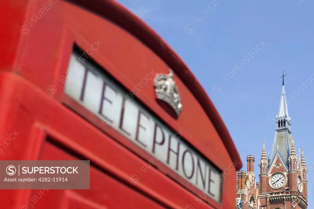 England, London, St Pancras. A red telephone box outside St Pancras International.