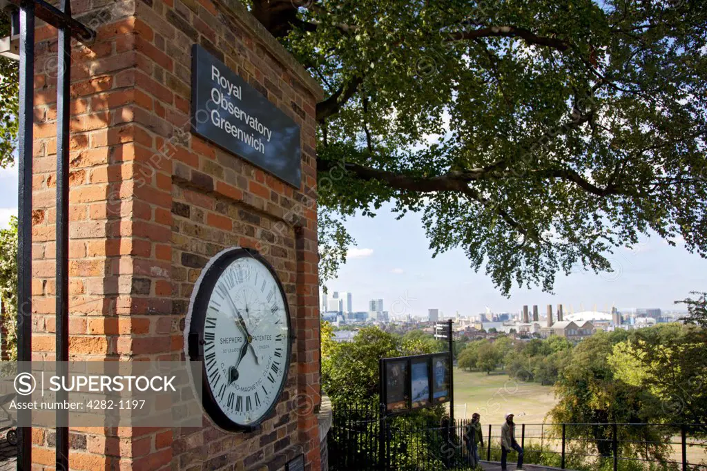 England, London, Greenwich. The Shepherd Gate Clock on a wall outside the Royal Observatory Greenwich. The clock was probably the first to display Greenwich Mean Time (GMT).