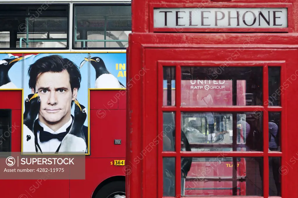 England, London, Pall Mall. A red telephone box and double decker bus.