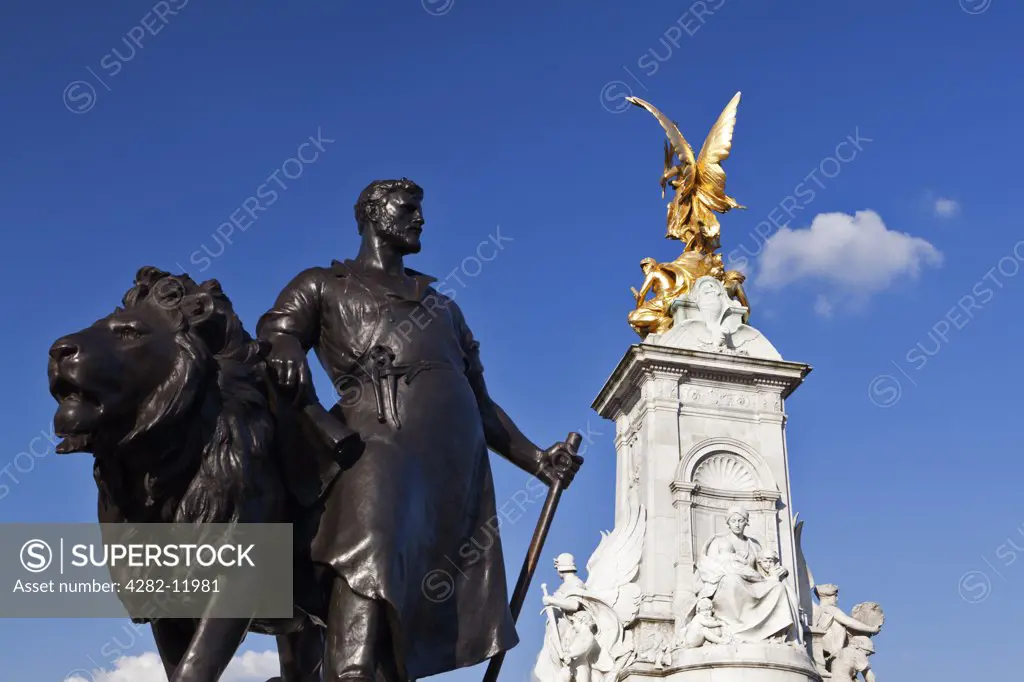 England, London, Buckingham Palace. Manufacture sculpture by Sir Thomas Brock at the base of the Queen Victoria Memorial outside Buckingham Palace.