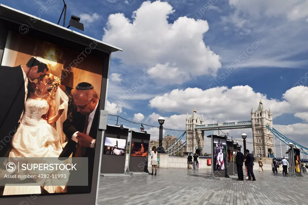 England, London, Tower Bridge. A photographic exhibition on the South Bank by Tower Bridge.