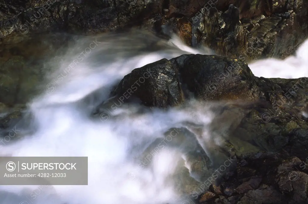 England, Cumbria, Langdale Fell. The flowing waters of Dungeon Ghyl force in Langdale Fell.