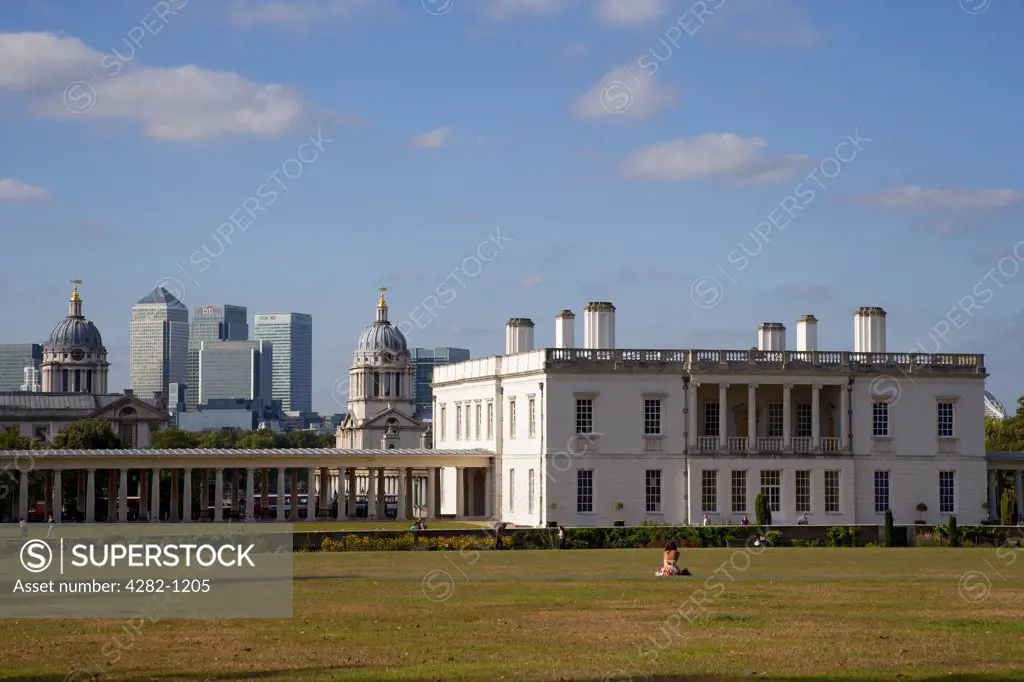 England, London, Greenwich. The Queen's House, a former royal residence built between 1614-1617 designed by Inigo Jones. The skyscrapers in the new financial district at Canary Wharf can be seen in the background.