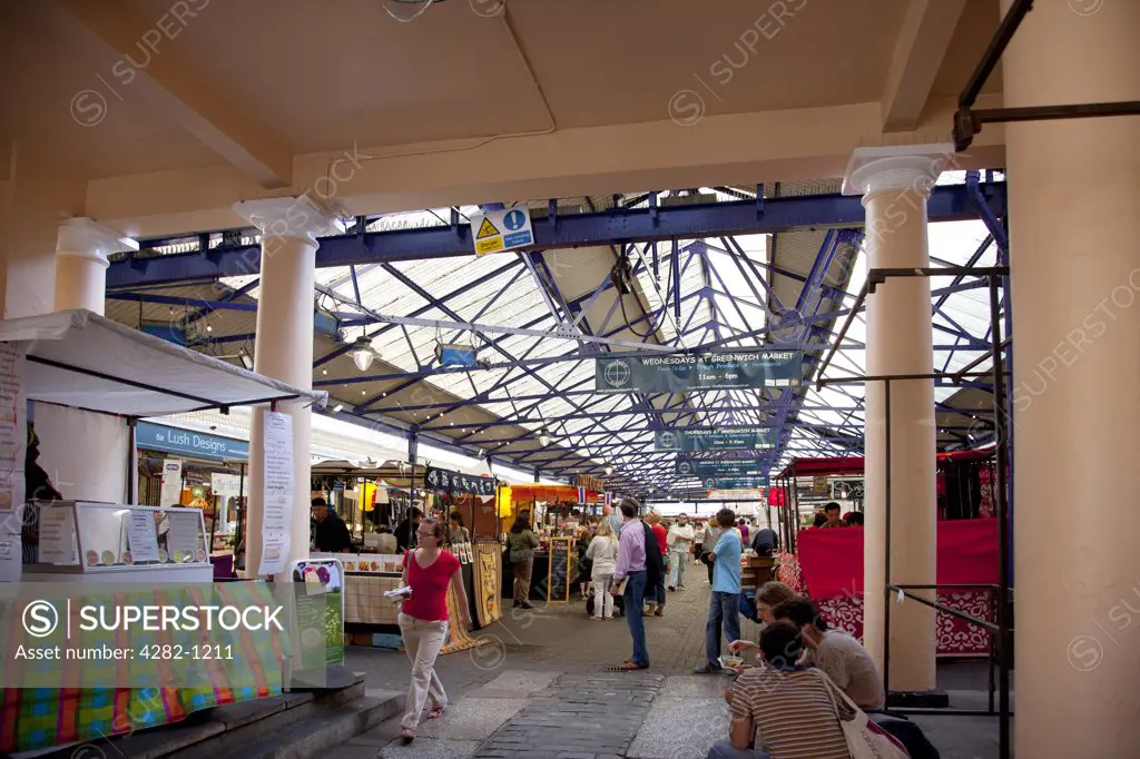 England, London, Greenwich. Food stalls inside Greenwich Market.