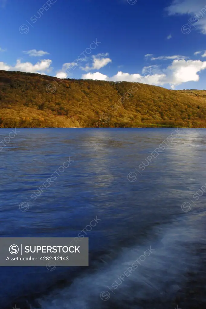 England, Cumbria, Coniston. Afternoon light illuminates the features of Coniston Water on the Cumbria Way.