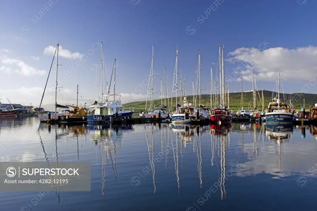Republic of Ireland, County Kerry, Dingle. Dingle Peninsula Boats reflected in the still waters of the Dingle Harbour in Dingle Bay.