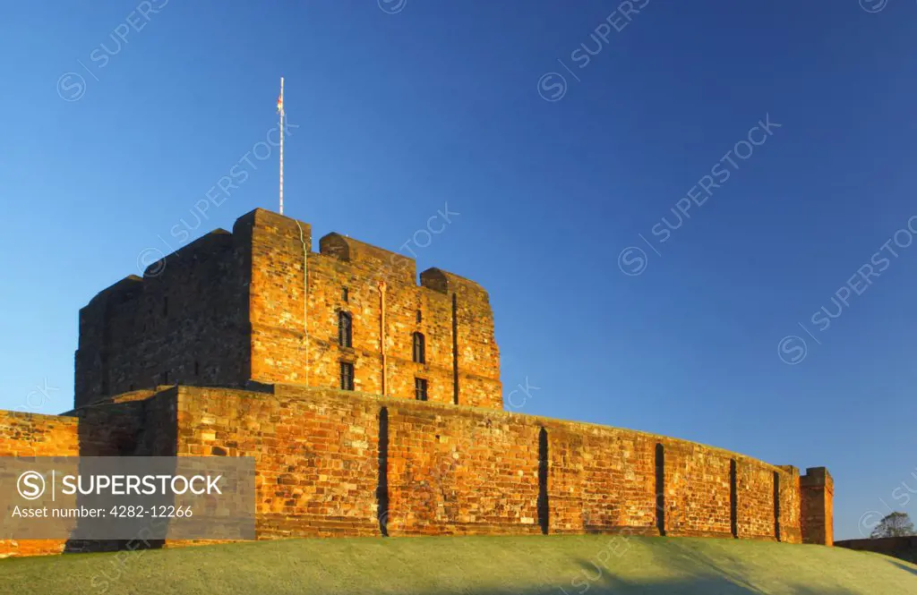 England, Cumbria, Carlisle Castle. Early morning winter sun illuminates the red sandstone of Carlisle Castle.