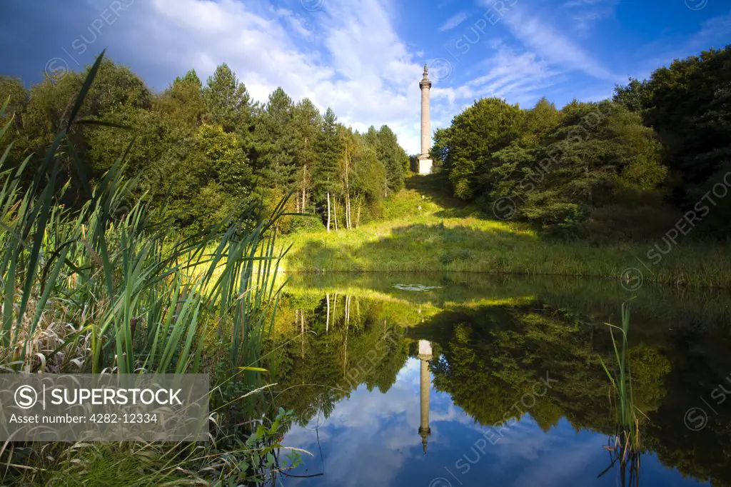 England, Tyne and Wear, Gibside. The column of liberty reflected in a pool forming part of the 18th-century landscaped 'forest' garden at Gibside, one of the North's finest landscapes.
