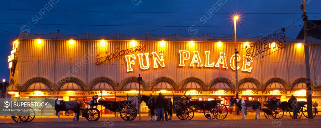 England, Lancashire, Blackpool. Hackney Carriages outside the Fun Palace amusement arcade on the Golden Mile.