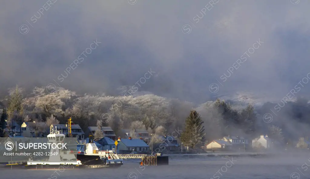 Scotland, Highland, Corran. The Corran ferry port with hoarfrost covered woodland behind.