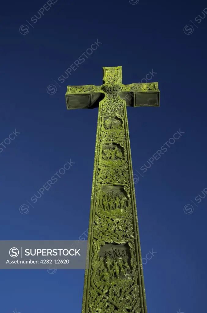 England, County Durham, Durham. A war memorial in the shape of the Cross of St Cuthbert, next to Durham Cathedral.