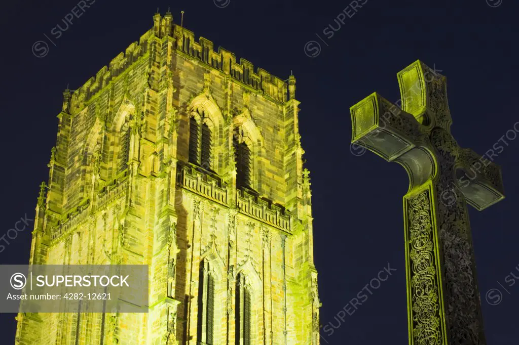 England, County Durham, Durham. A war memorial in the shape of the Cross of St Cuthbert, next to Durham Cathedral.