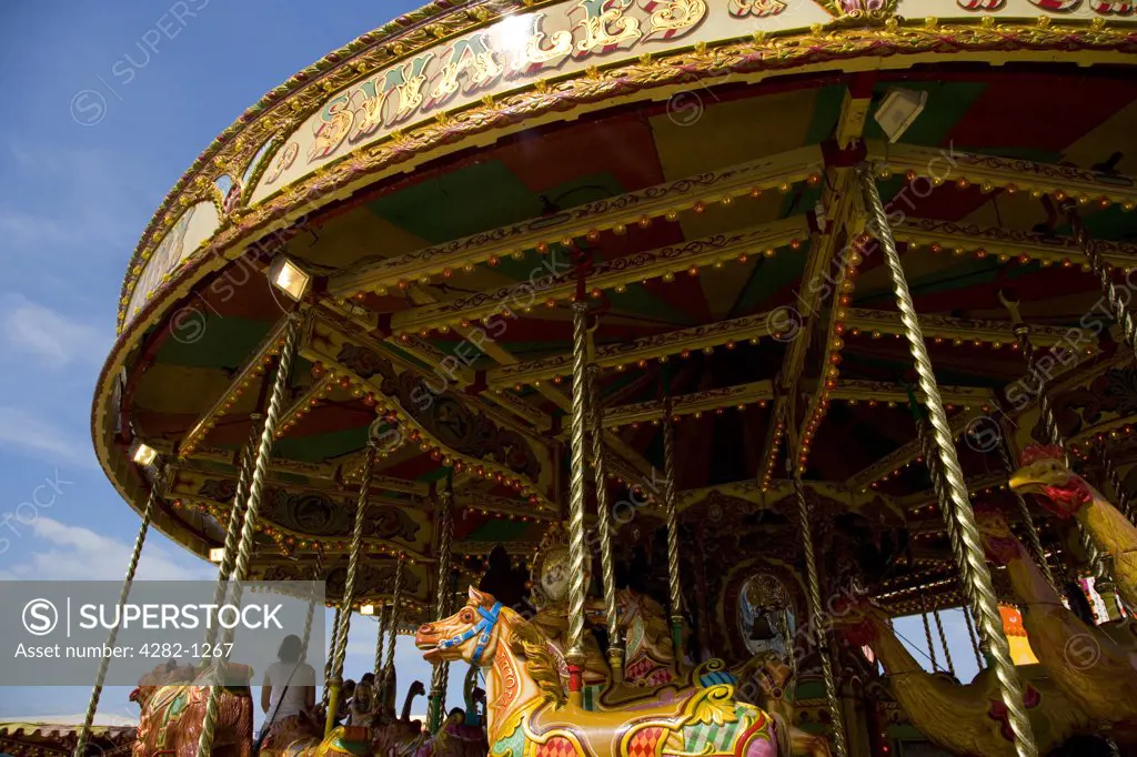 England, Kent, Whitstable. A traditional carousel at a fair in Whitstable.