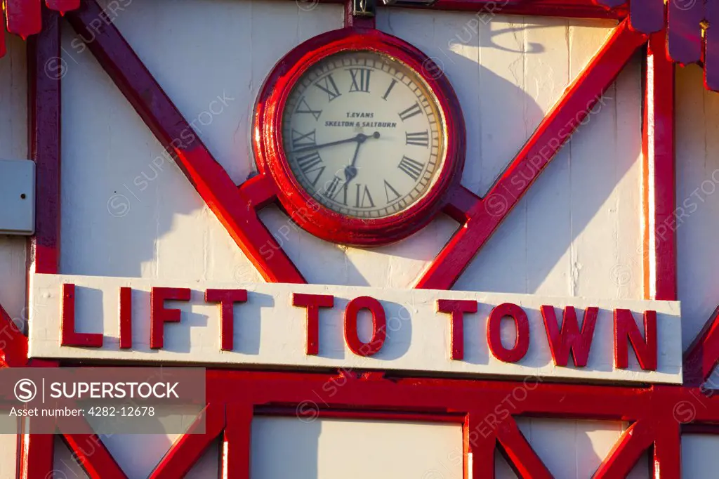 England, Redcar & Cleveland, Saltburn-By-The-Sea. ""Lift to town"" sign on the station of the funicular railway, one of the world's oldest water-powered cliff lifts.