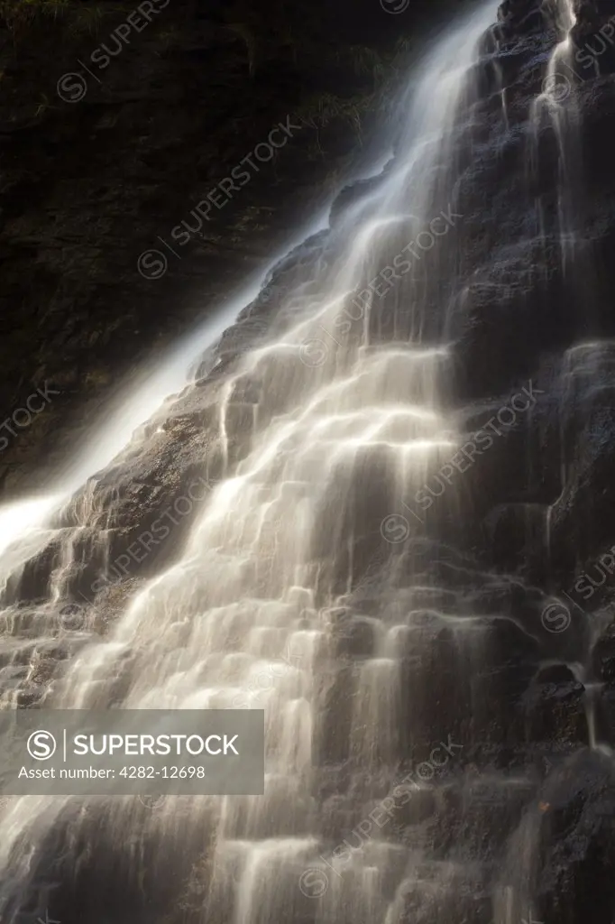 England, Northumberland, near Bellingham. Hareshaw Linn is a spectacular waterfall located in a steep sided gorge, which continues to flow through a wooded valley. Hareshaw Linn is located near Bellingham within the Northumberland National Park.