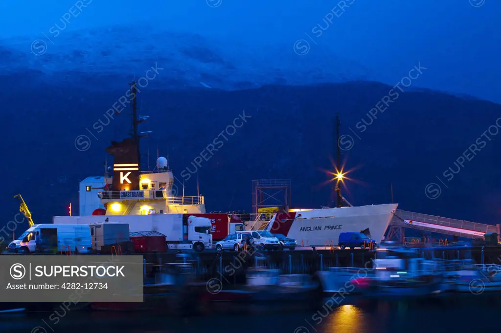 Scotland, Highland, Ullapool. Fishing boats and coastguard ship moored in the busy port at Ullapool on the shores of Loch Broom.