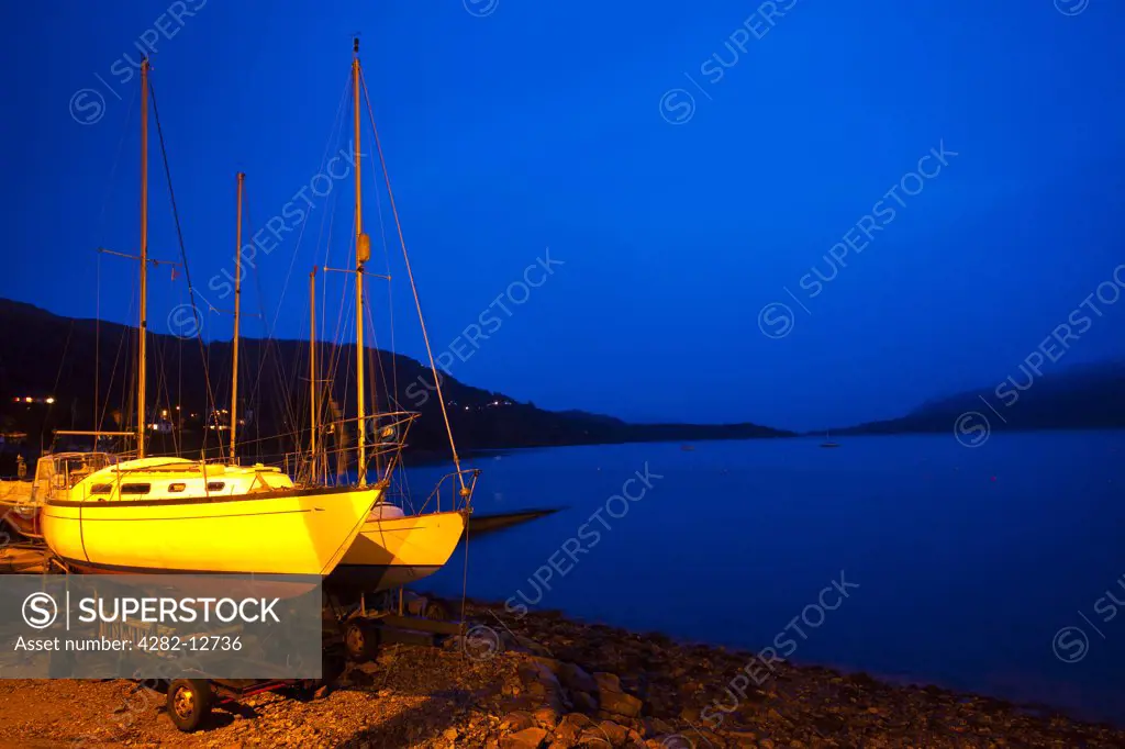 Scotland, Highland, Ullapool. Sailing boats moored near the busy port at Ullapool on the shores of Loch Broom.