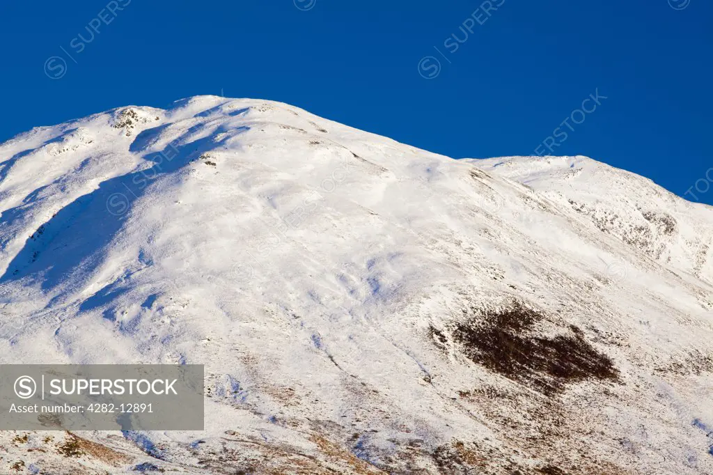 Scotland, Highland, Glencoe. Snow covered mountain near Glencoe.