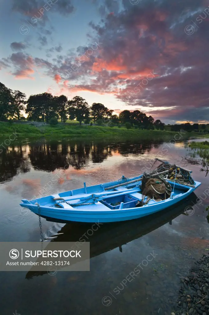 England, Northumberland, Norham. A salmon fishing boat at Canny Fishery in Norham.