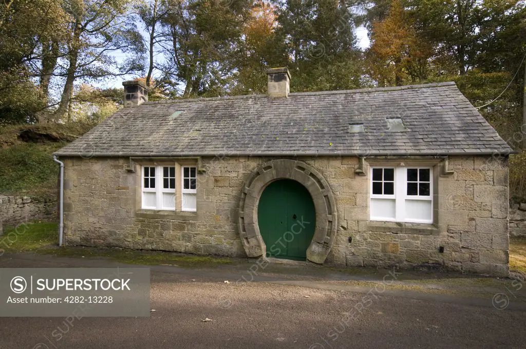 England, Northumberland, Ford. The old smithy in Ford, built for the Marchioness of Waterford in 1863. The double door at the front is in a raised horseshoe surround.