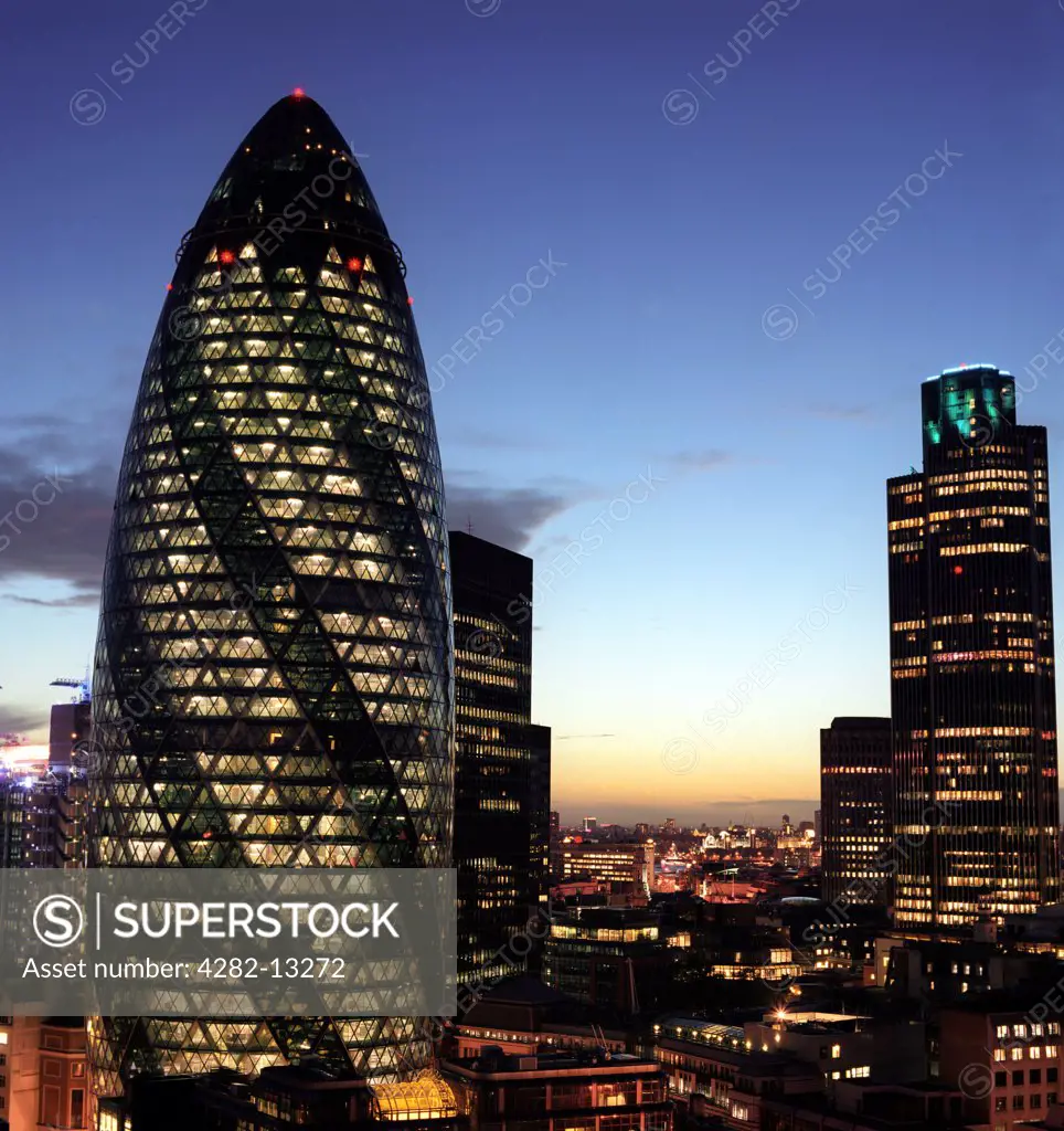 England, London, The City. The Gherkin and Natwest Tower buildings in London at night.